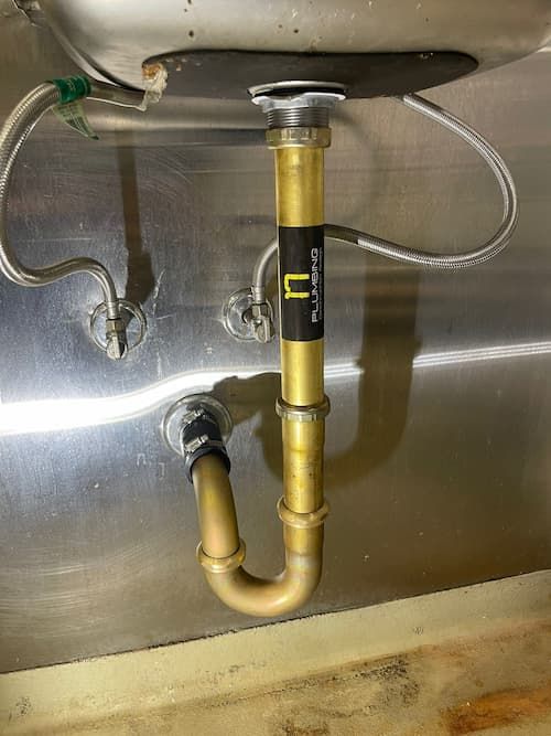 New drain for commercial kitchen sink in Oakville, Ontario.