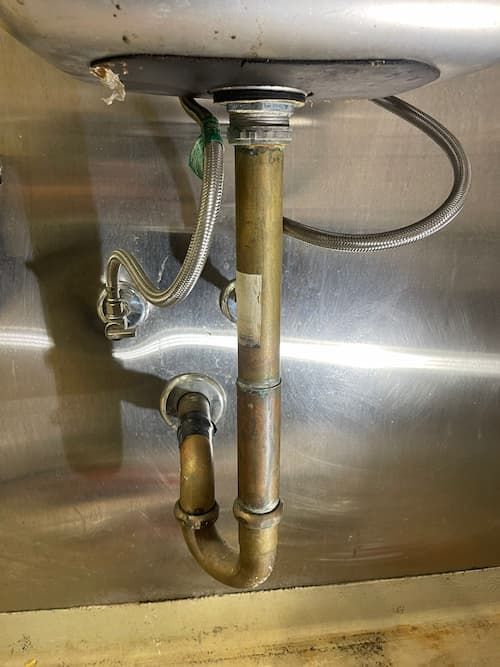 old pipe of commercial kitchen sink