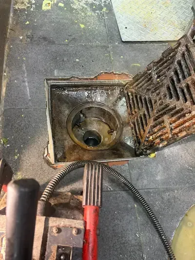 floor drain partially cleared but still blocked inside pipe emergency plumber oakville