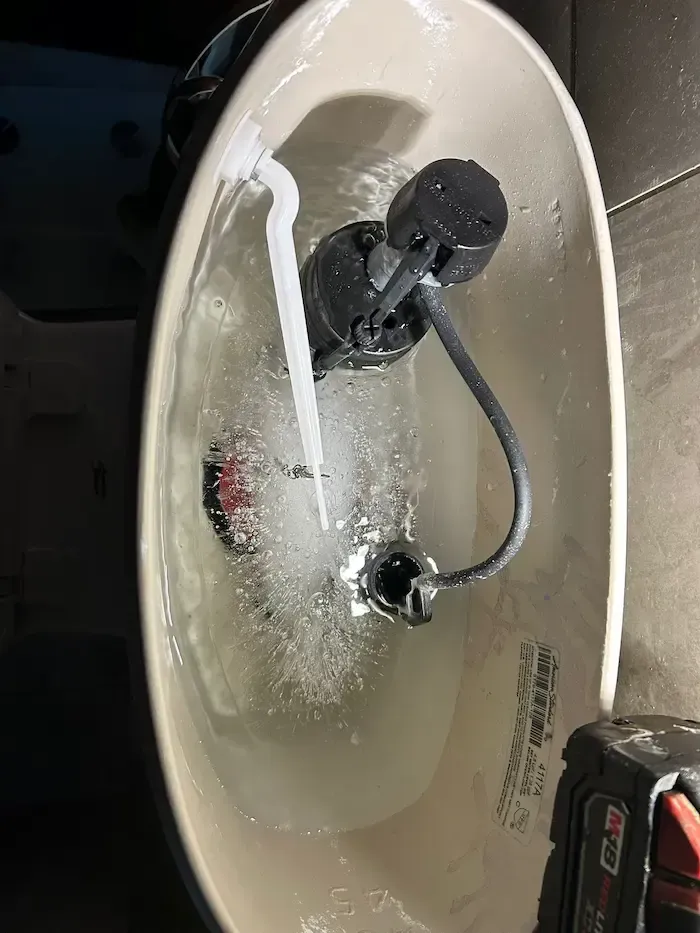 Frozen toilet tank causing internal pressure and pipe failure during winter conditions in Oakville home.