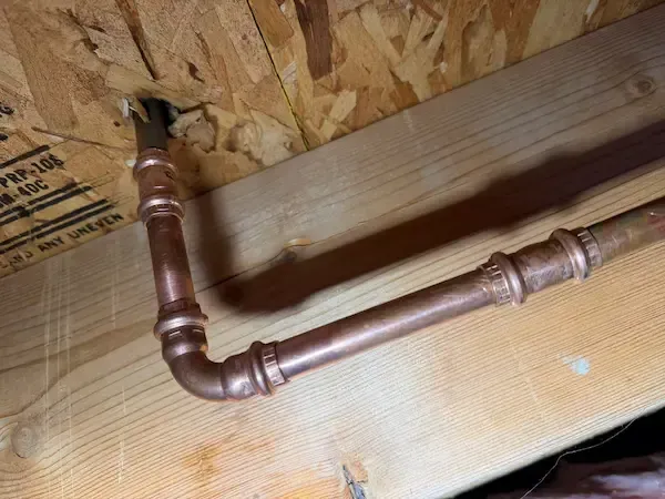 Copper pipe repair completed during leak detection service by licensed Oakville plumbing professionals.