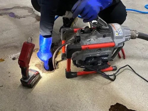 Professional drain cleaning machine used in Oakville for emergency sewer blockage removal