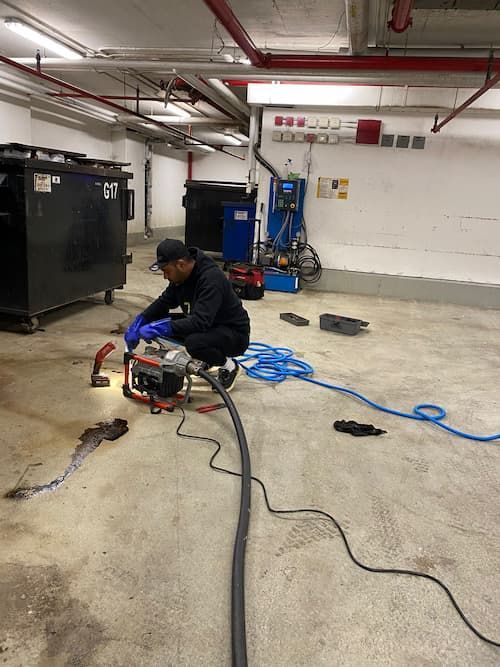 17 Plumbing performing powerflushing
