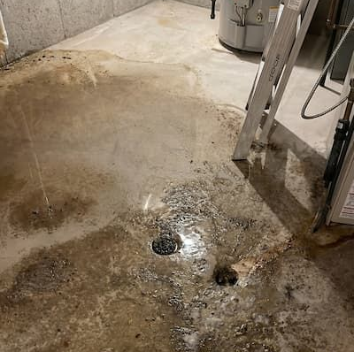 Basement floor drain backing up due to main sewer blockag