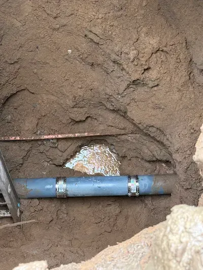 Underground drain pipe repair Oakville showing a repaired main sewer line approximately 10 feet below grade.