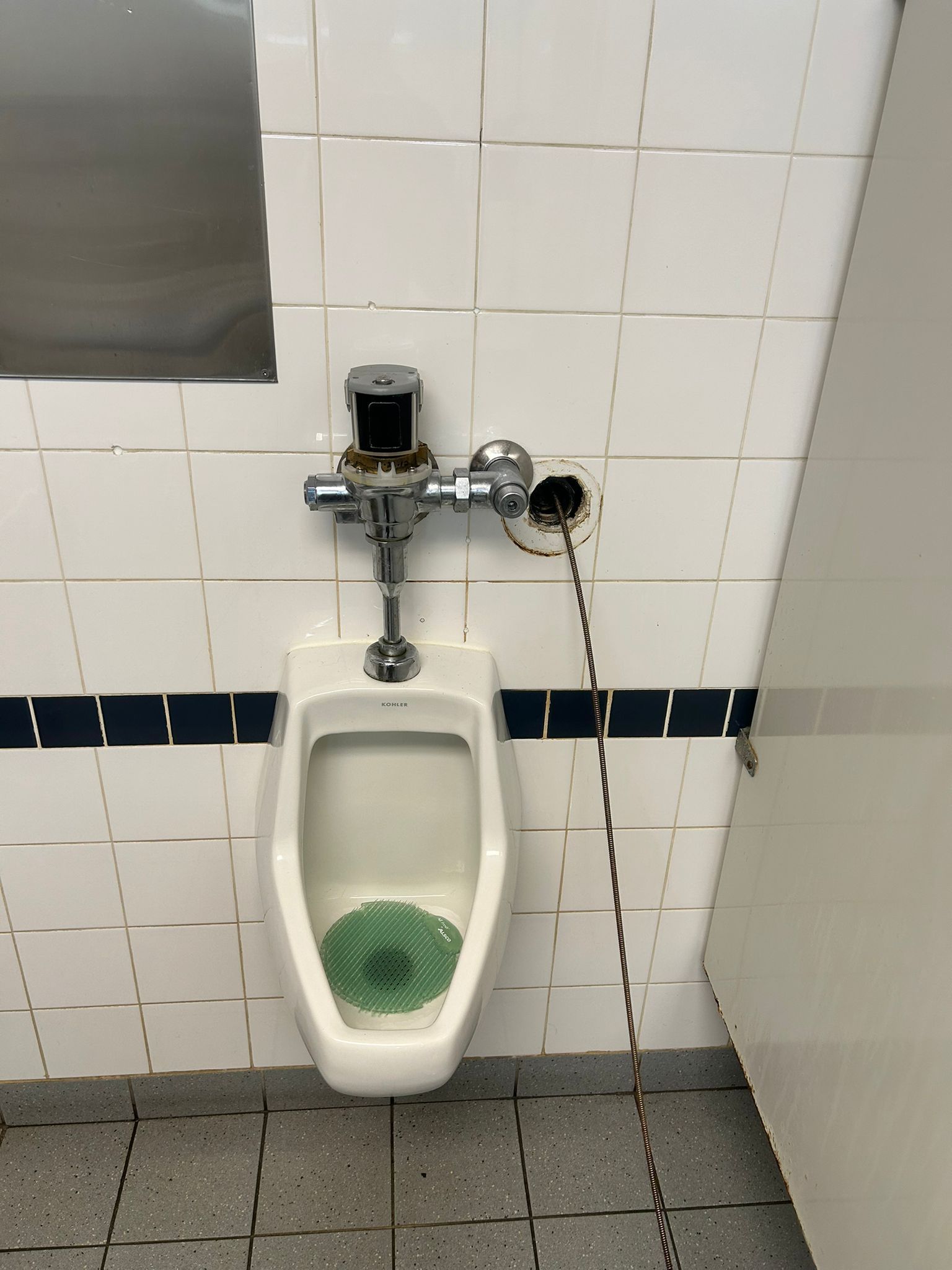 Commercial urinal drain blockage in Oakville requiring professional drain service