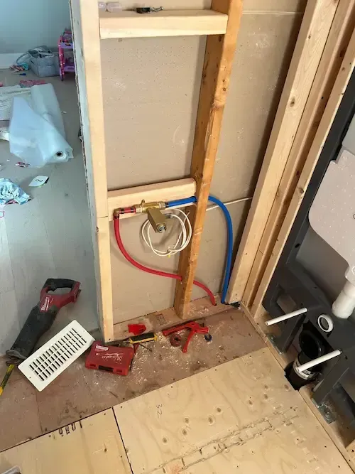 In wall toilet plumbing installation during Oakville bathroom renovation by 17 Plumbing