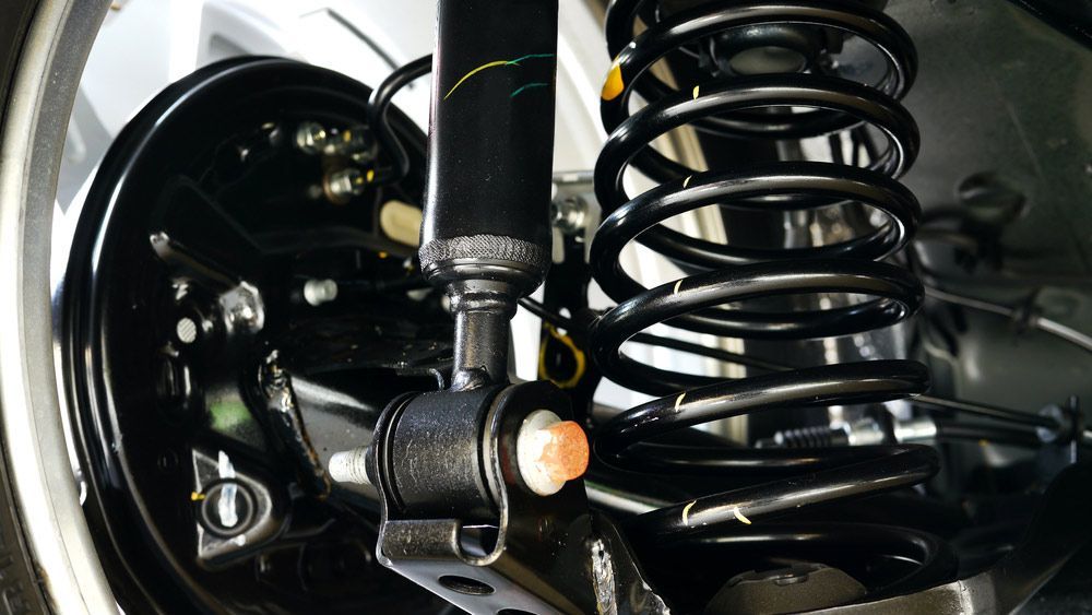 A Close Up of a Shock Absorber on a Car — Loch’s Garage In Emerald, QLD