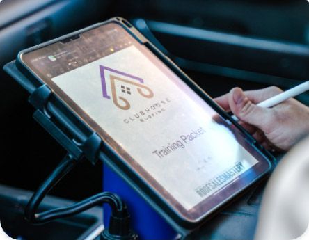 a person is writing on a tablet with a pen