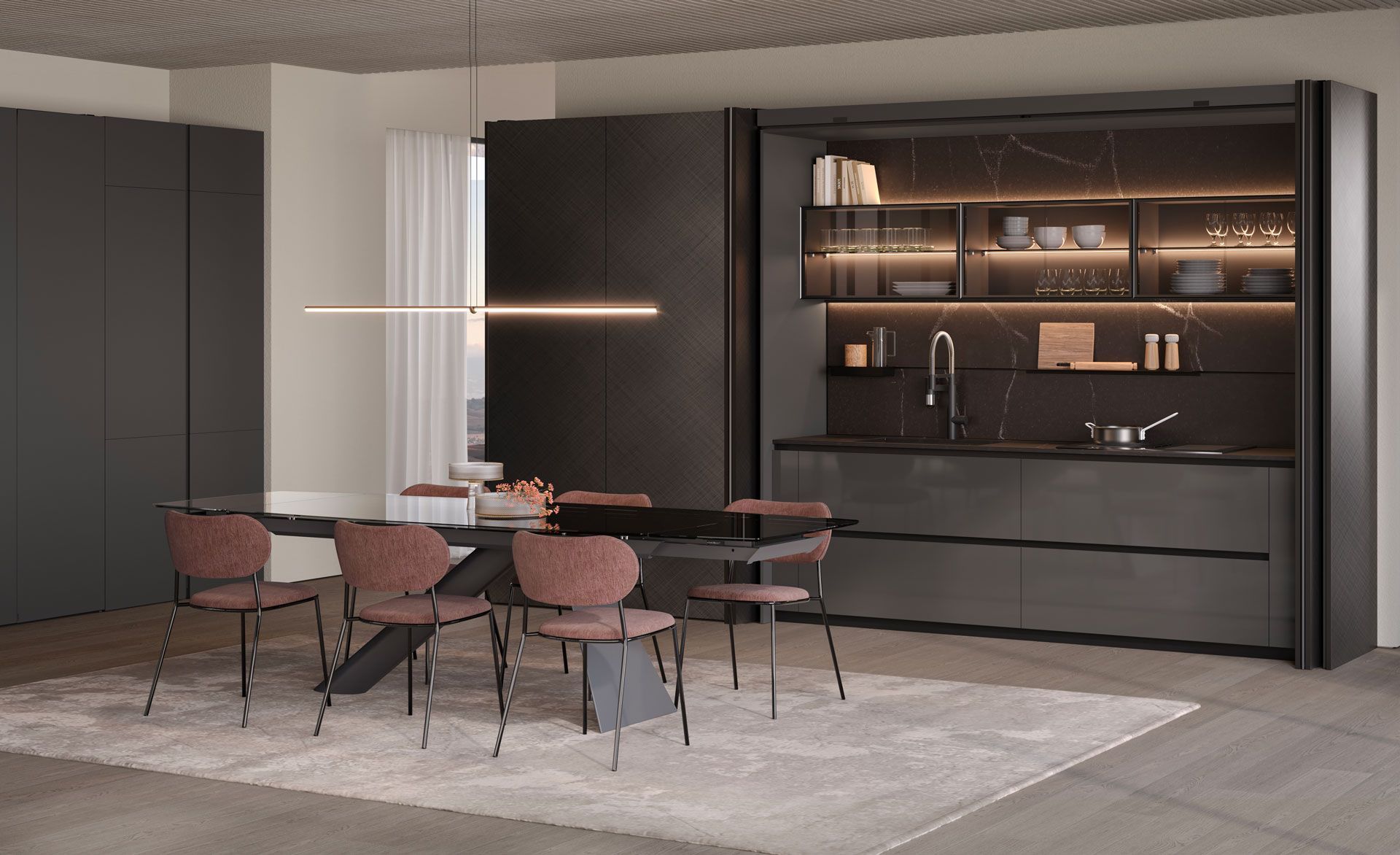 Una sala da pranzo con tavolo e sedie e una cucina sullo sfondo.