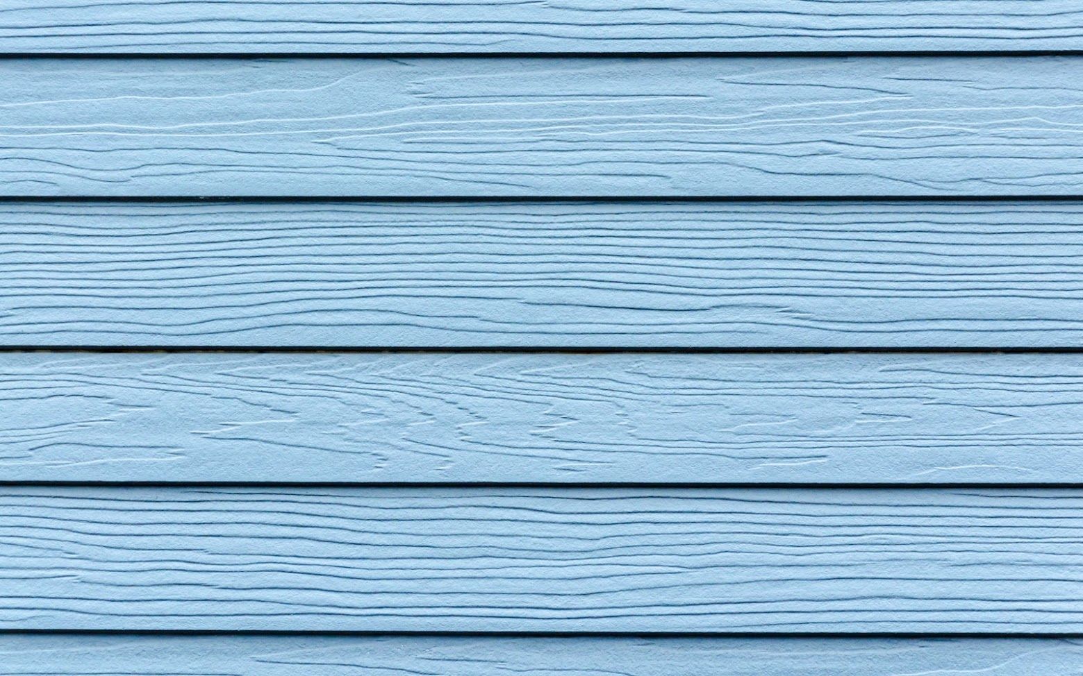 Light blue horizontal wood siding texture.