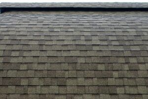 Brown asphalt shingle roof, with a slightly textured surface and an even pattern.