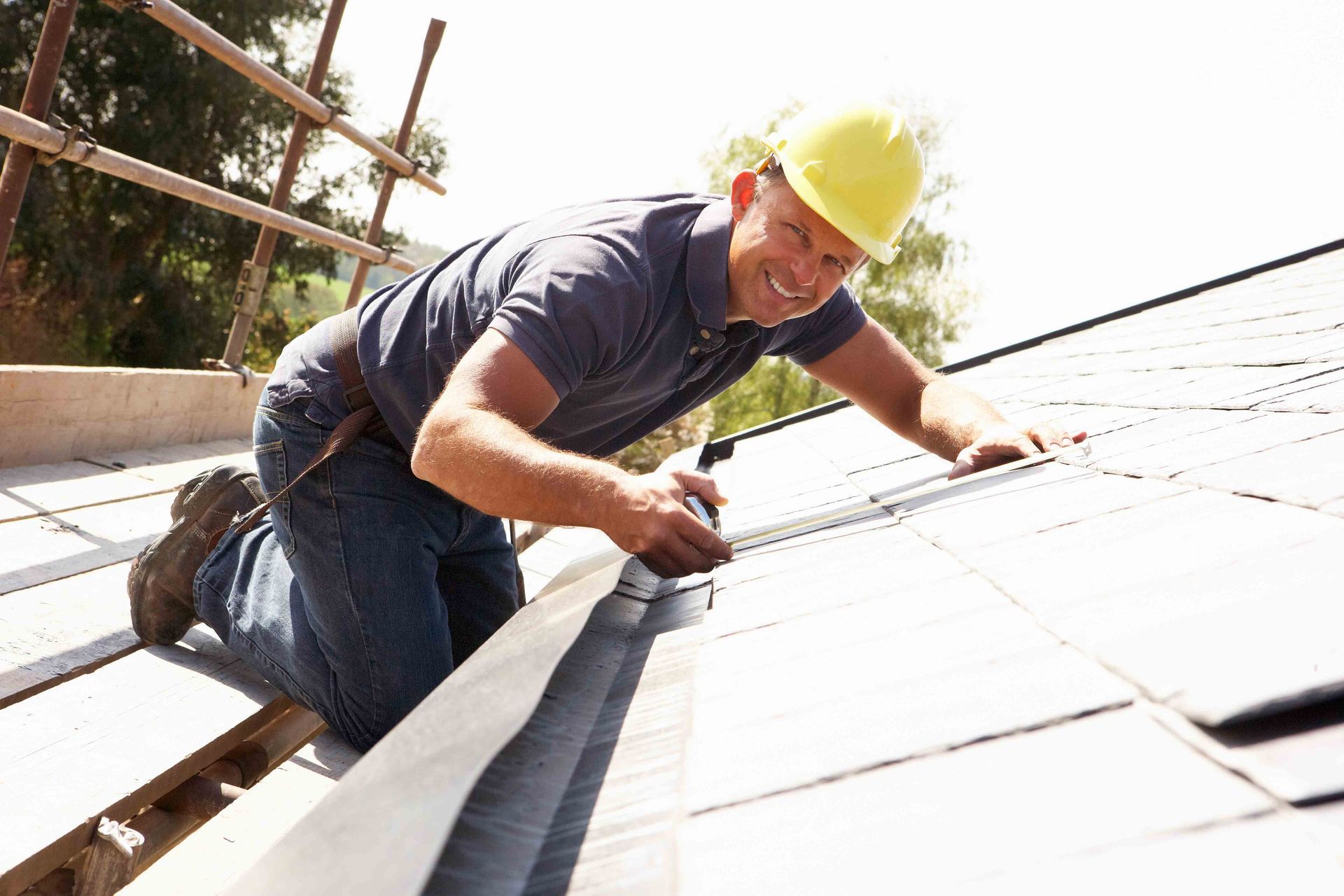 A person working on a roof | roofing contractor in Richfield MN | D.S. Bahr Construction, Inc
