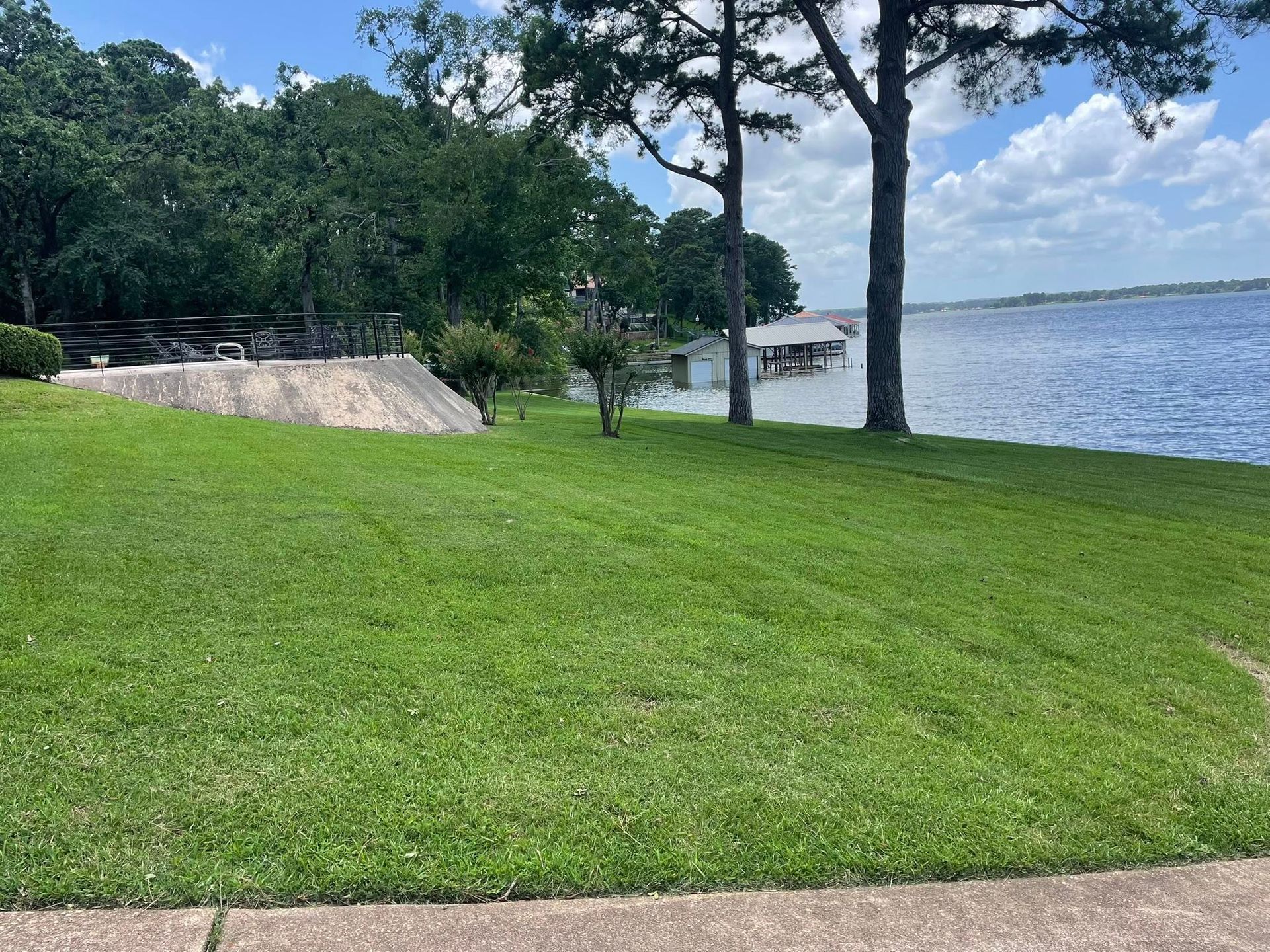A large house with a lush green lawn in front of it.