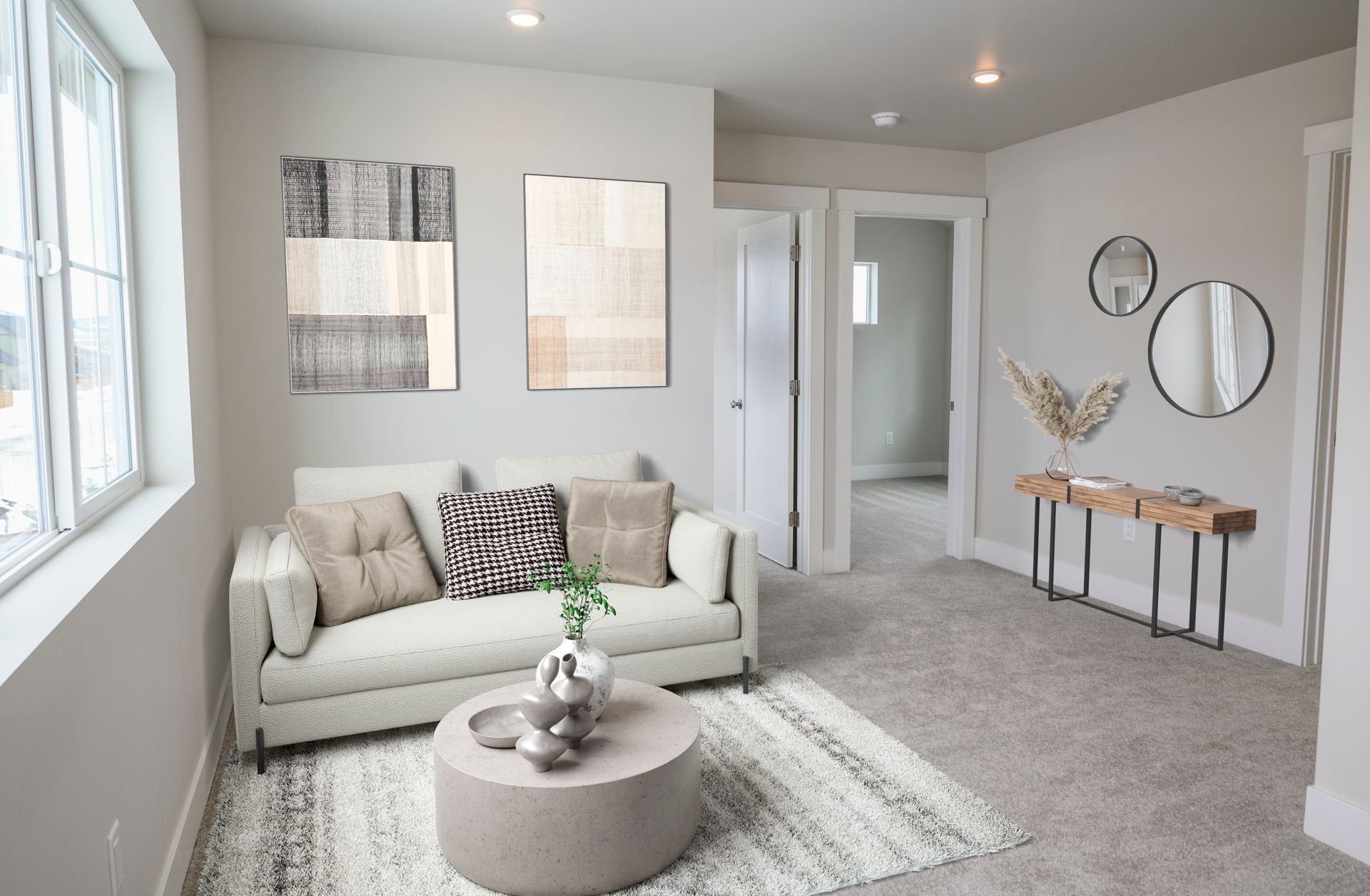 Cozy den area at The Grange apartments with comfortable seating and stylish décor.