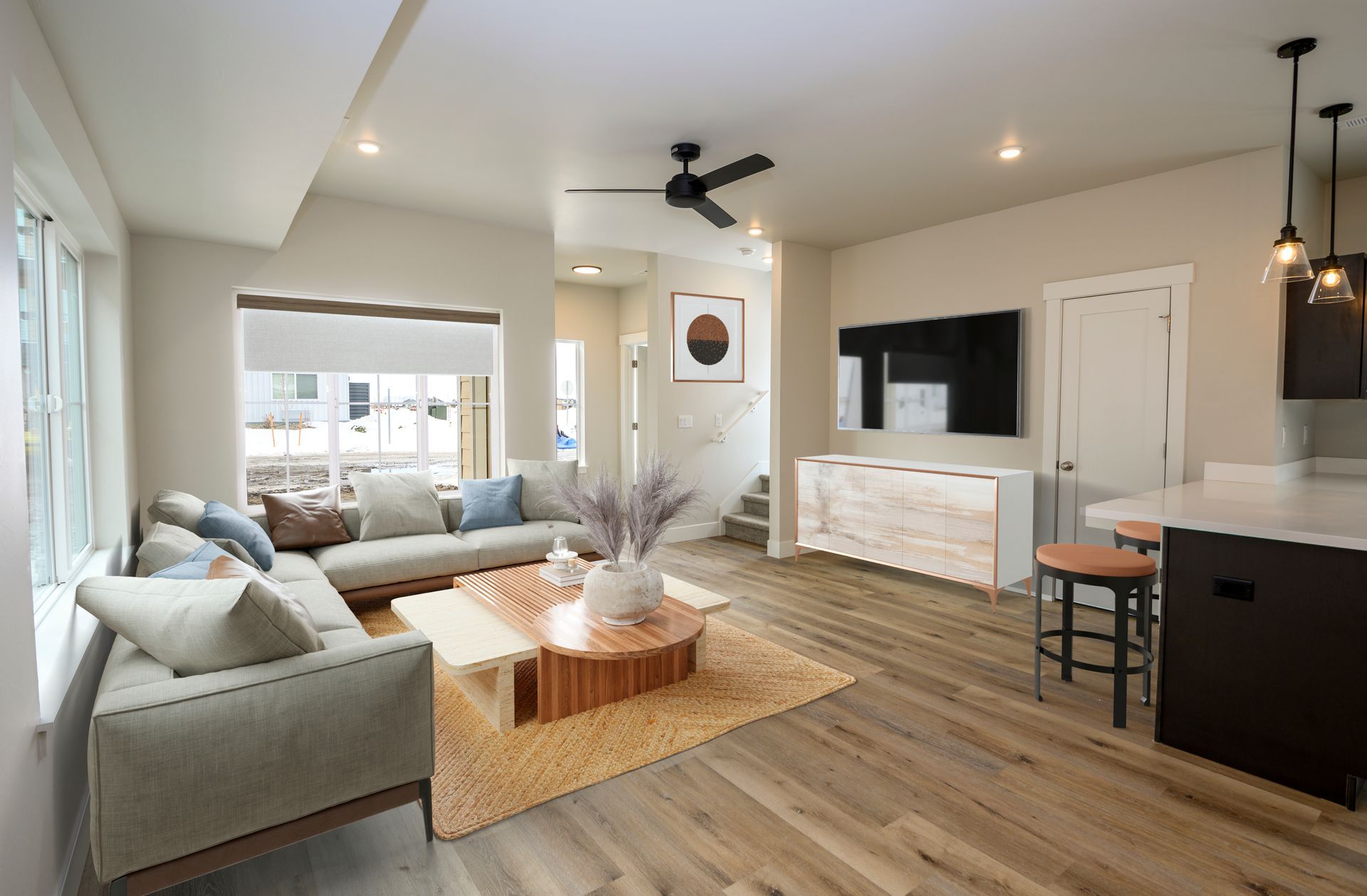 Modern living room at The Grange apartments featuring contemporary furnishings and natural light.