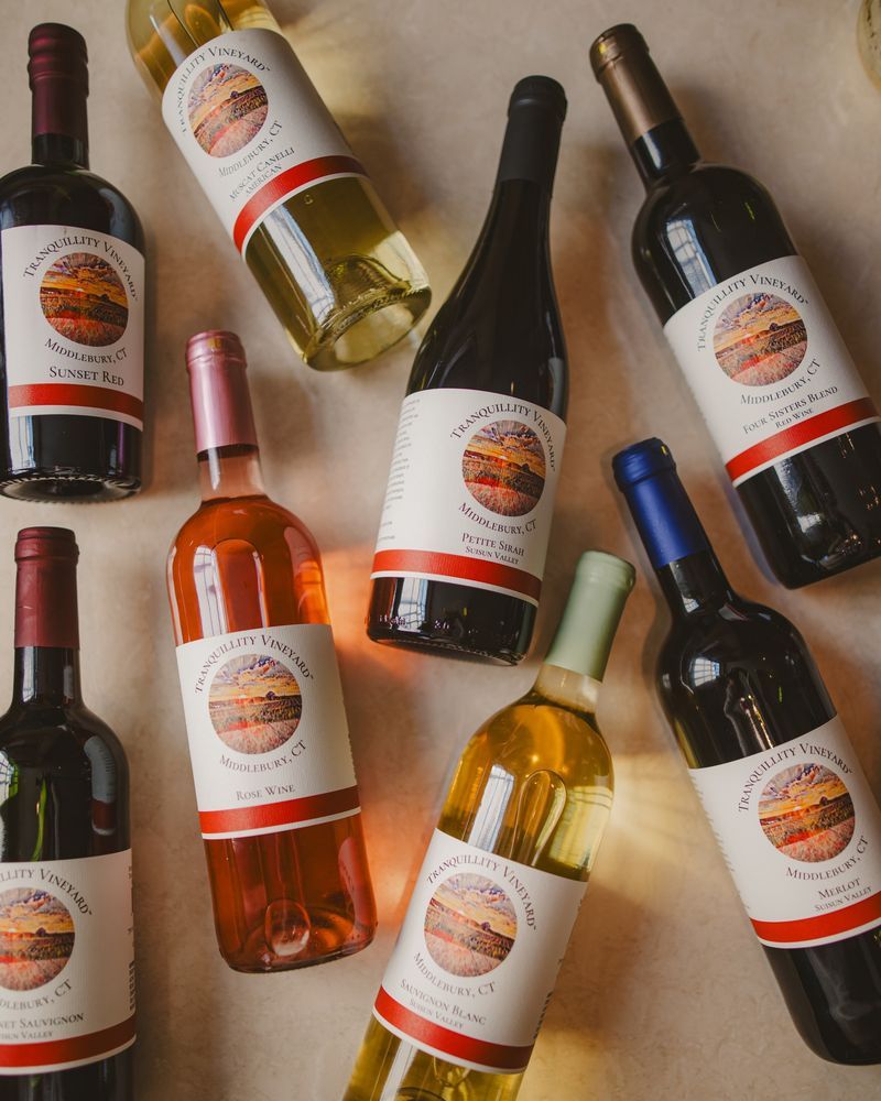 A bunch of bottles of wine are sitting on a table