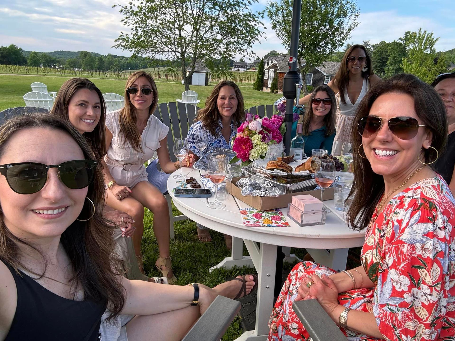 A group of women are sitting around a table