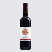Dark wine bottle with a white label and maroon cap on a light background