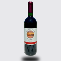 Bottle of red wine with a green neck and white label on a plain background