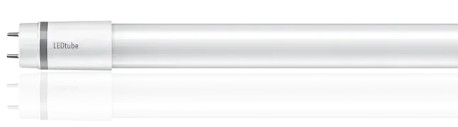 Une ampoule blanche est posée sur une surface blanche.