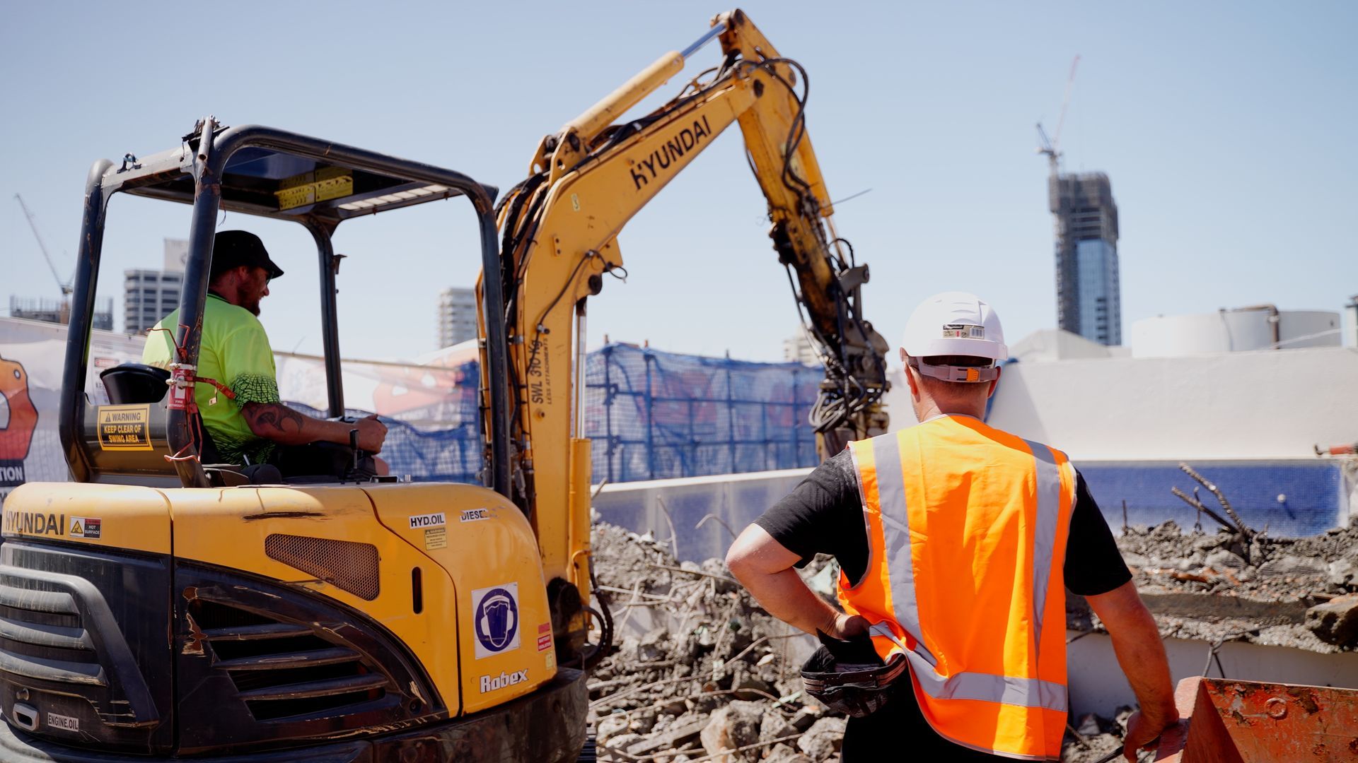 Yellow Excavator is Digging a Hole in the Ground — On Demand Diggers & Demolitions in Sunshine Coast, QLD