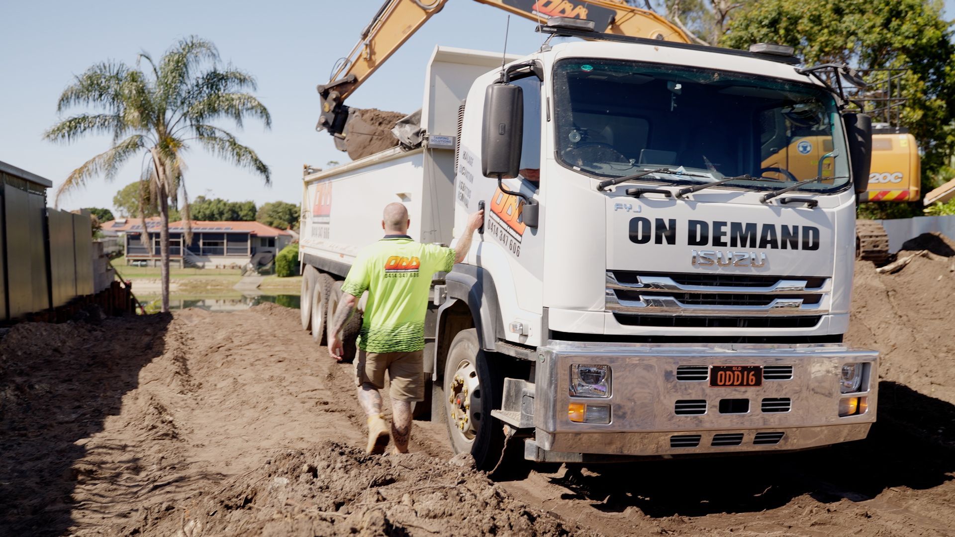 Yellow Excavator is Demolishing a Building — On Demand Diggers & Demolitions in Molendinar, QLD