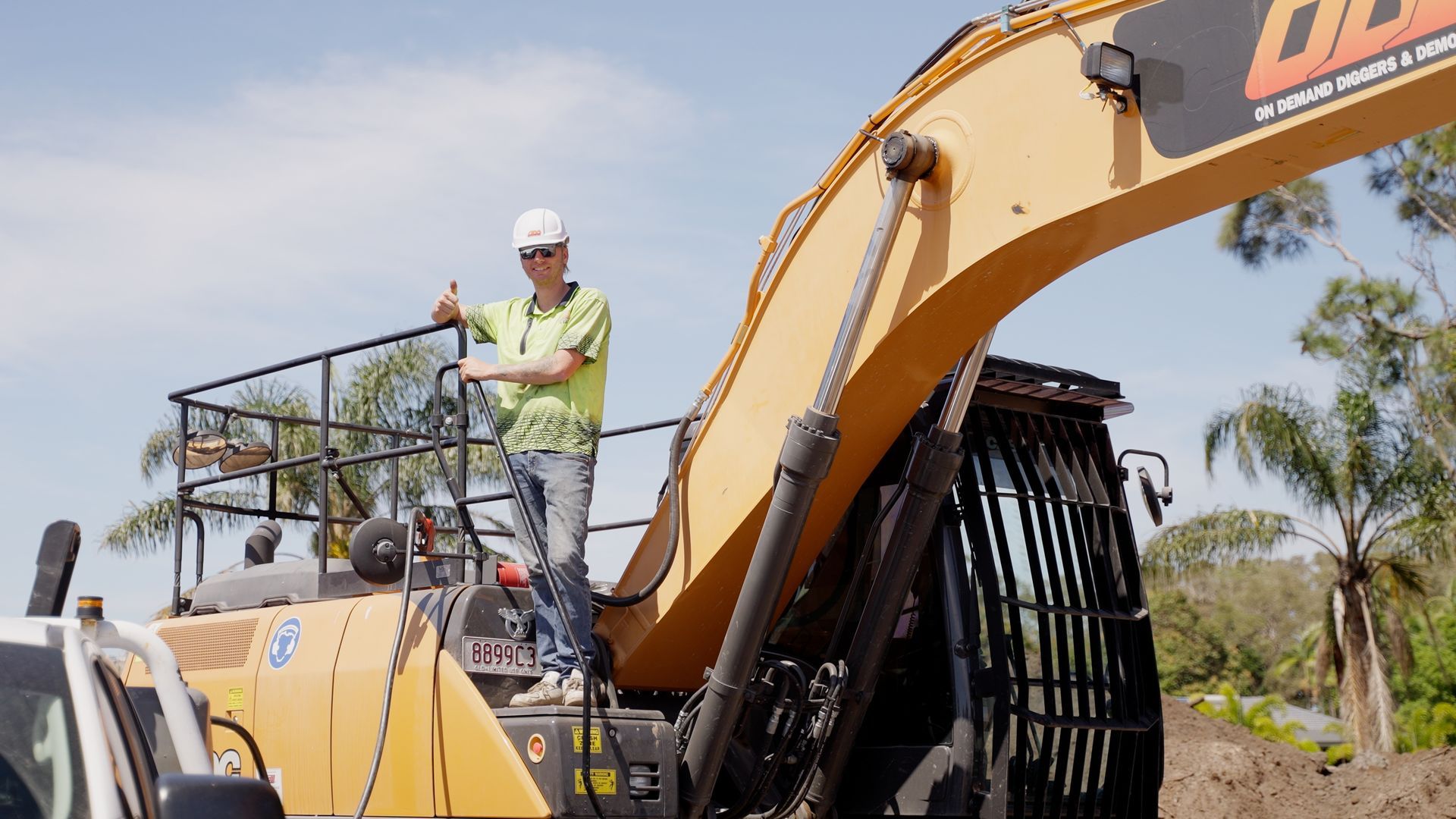 Yellow Excavator is Demolishing a Building in the Snow — On Demand Diggers & Demolitions in Sunshine Coast, QLD