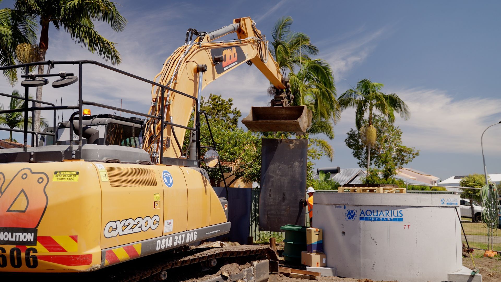 Yellow Excavator Demolishing Concrete — On Demand Diggers and Demolitions in Byron Bay, NSW