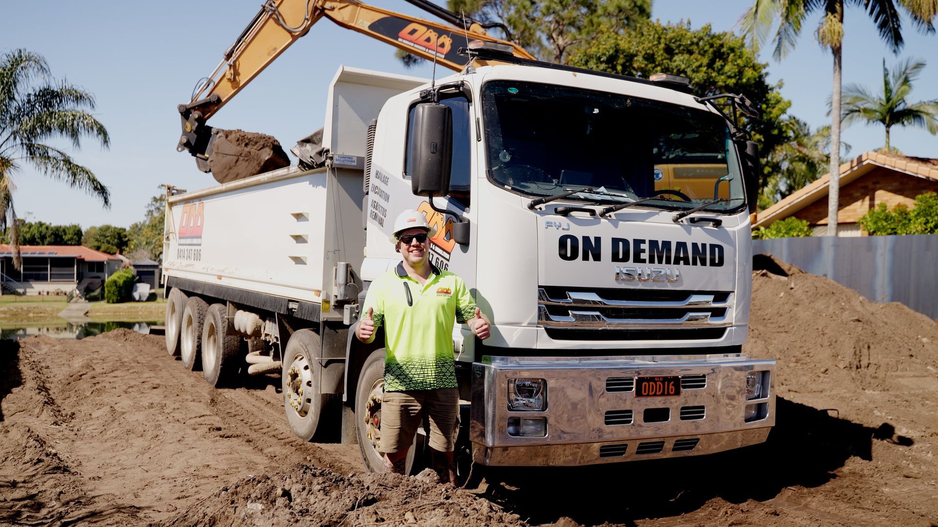 Couple of Excavators Are Sitting on Top of a Pile of Dirt — On Demand Diggers & Demolitions in Molendinar, QLD