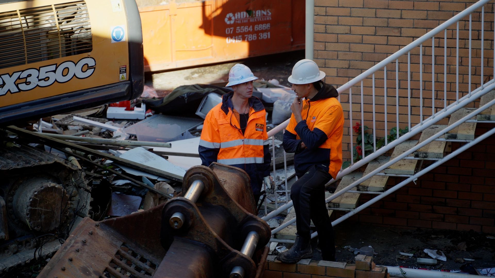 Bulldozer is Pouring Dirt Into a Pile — On Demand Diggers & Demolitions in Brisbane, QLD