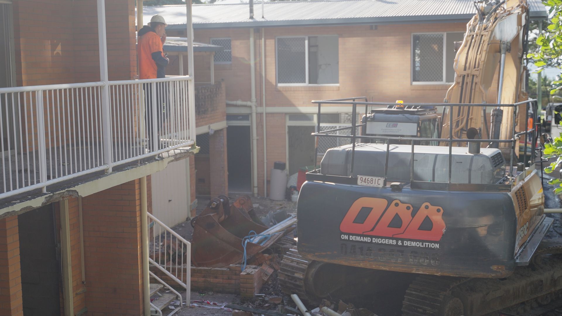 Small Orange Bulldozer is Driving Through a Muddy Field in the Woods — On Demand Diggers & Demolitions in Molendinar, QLD
