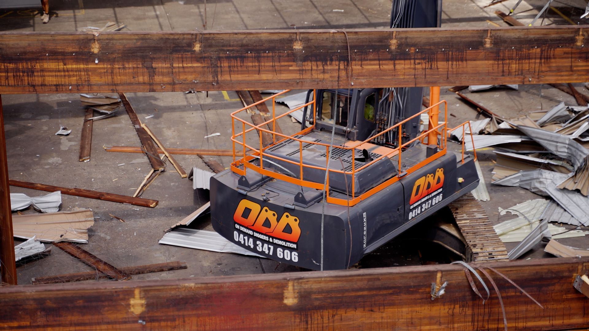 An Excavator is Moving Rocks on a Construction Site — On Demand Diggers & Demolitions in Molendinar, QLD