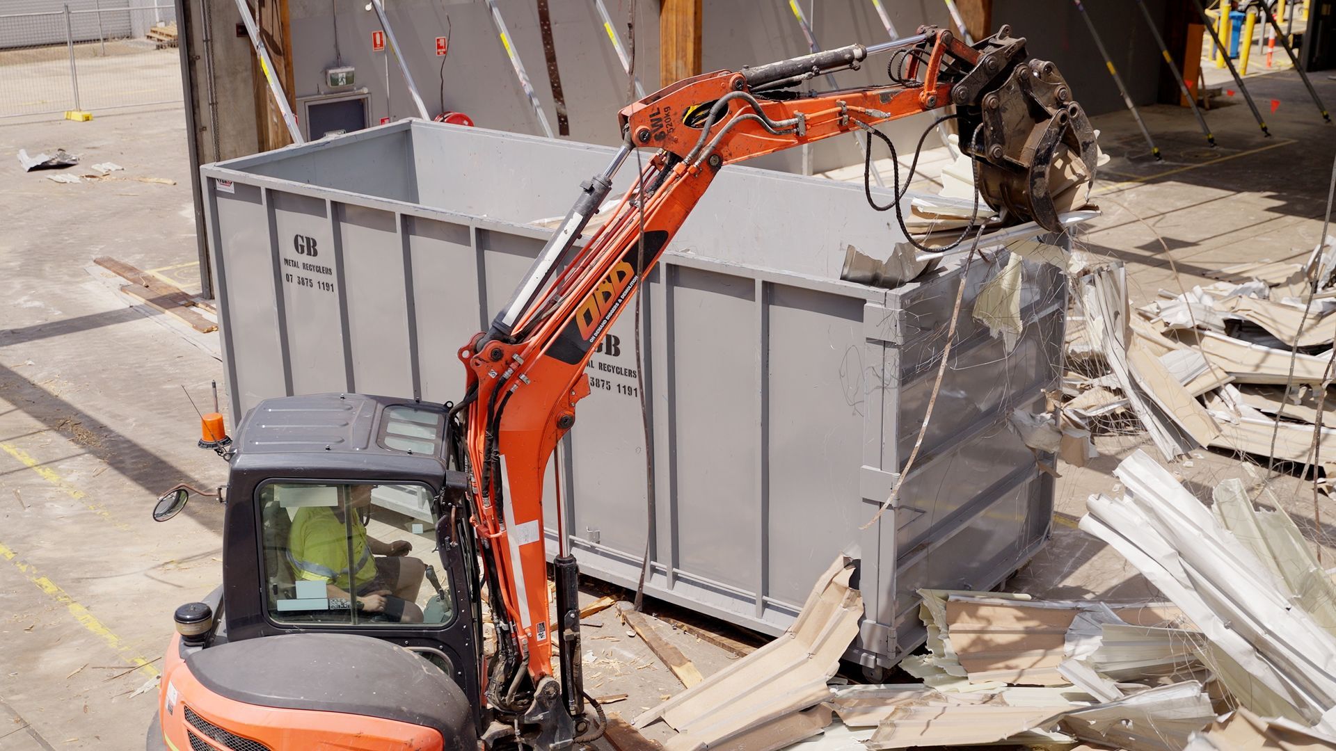 Large Orange Excavator is Digging a Hole in a Construction Site — On Demand Diggers & Demolitions in Molendinar, QLD