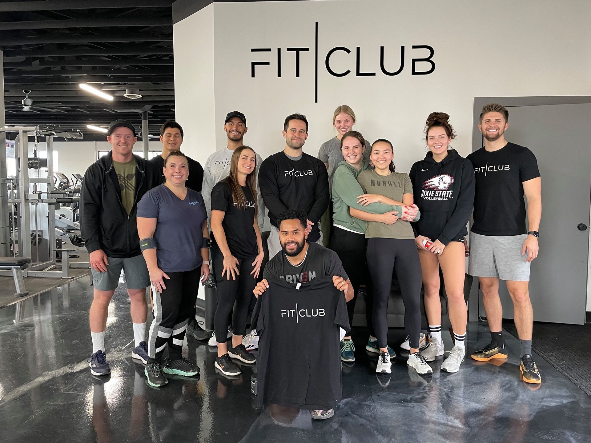 FitClub team and members together in Salem, Utah gym for fitness community.