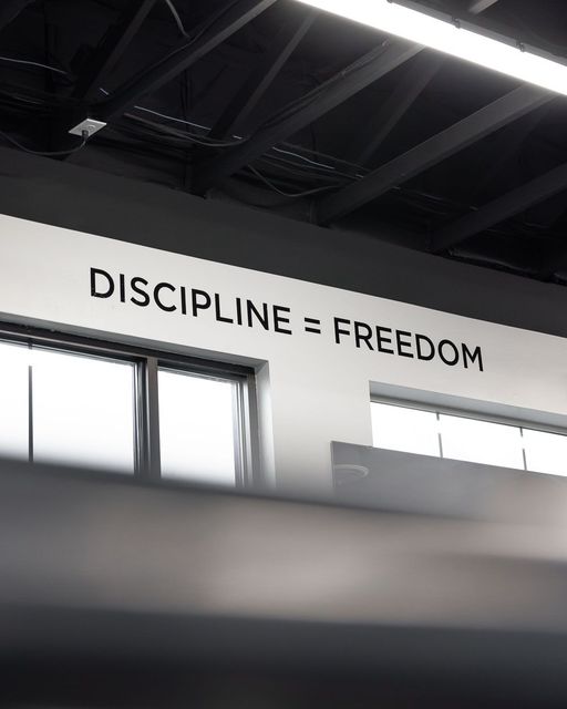 Motivational wall at FitClub gym in Salem, Utah with the quote 'Discipline = Freedom.