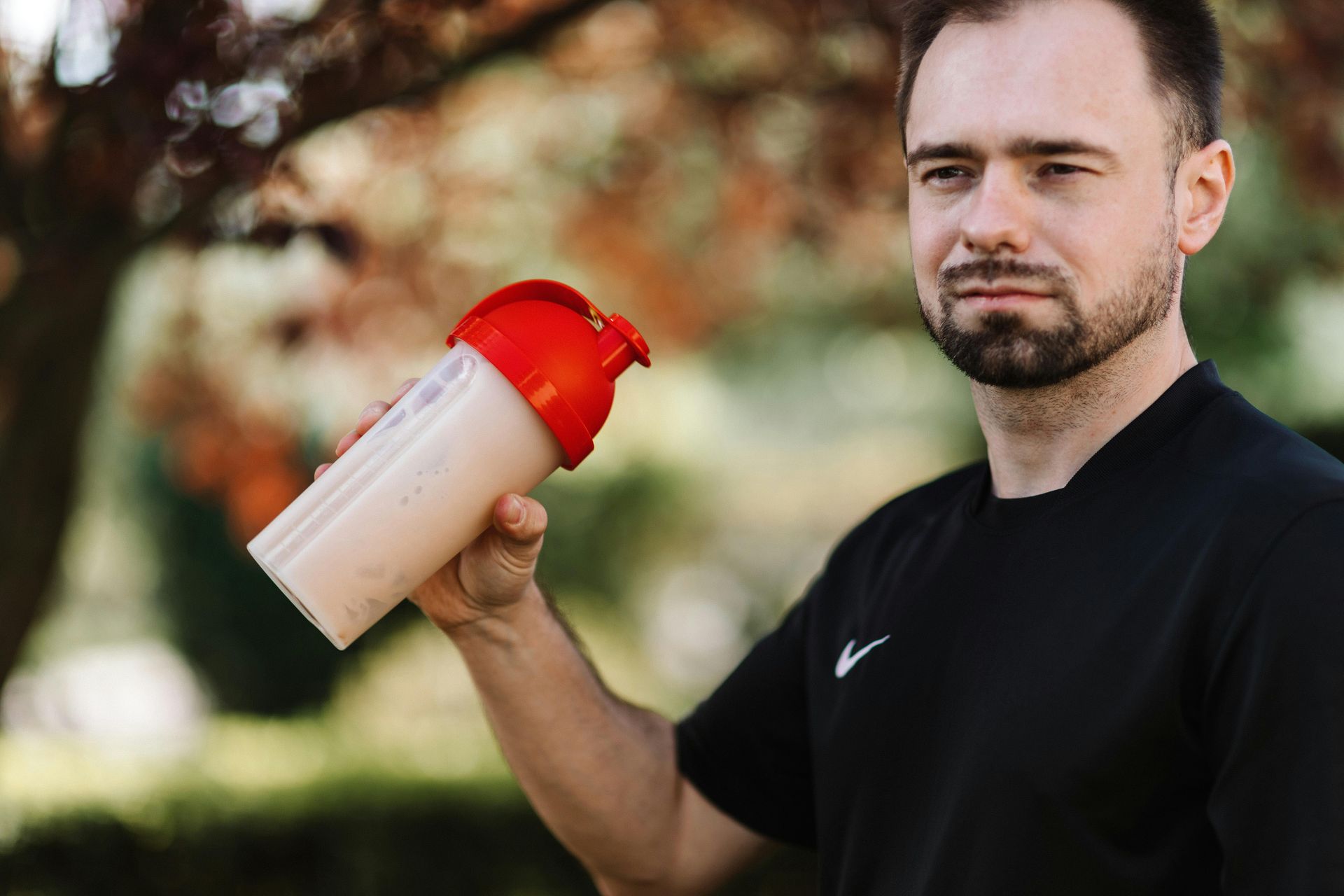 FitClub member in Salem, Utah, enjoying a protein shake post-workout for recovery.