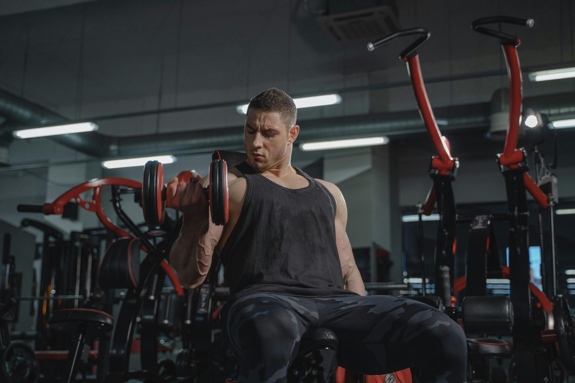 Weightlifting training at FitClub gym in Salem, Utah, focusing on strength building.