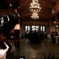 Dimly lit banquet hall with chandeliers and a crowd gathered near the front windows.