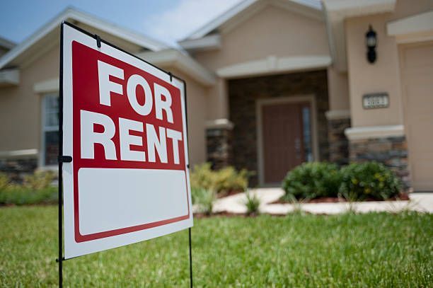 A for rent sign in front of a house