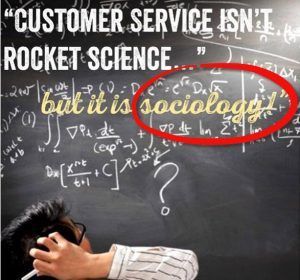 A man is writing on a blackboard with the words customer service isn 't rocket science but it is sociology