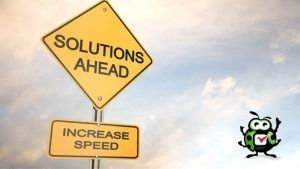 A yellow sign that says solutions ahead and increase speed