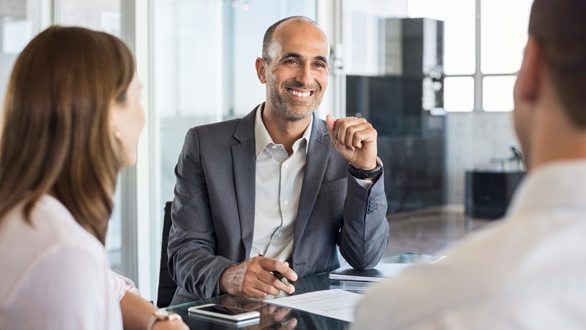 two individuals discuss commercial insurance for their business