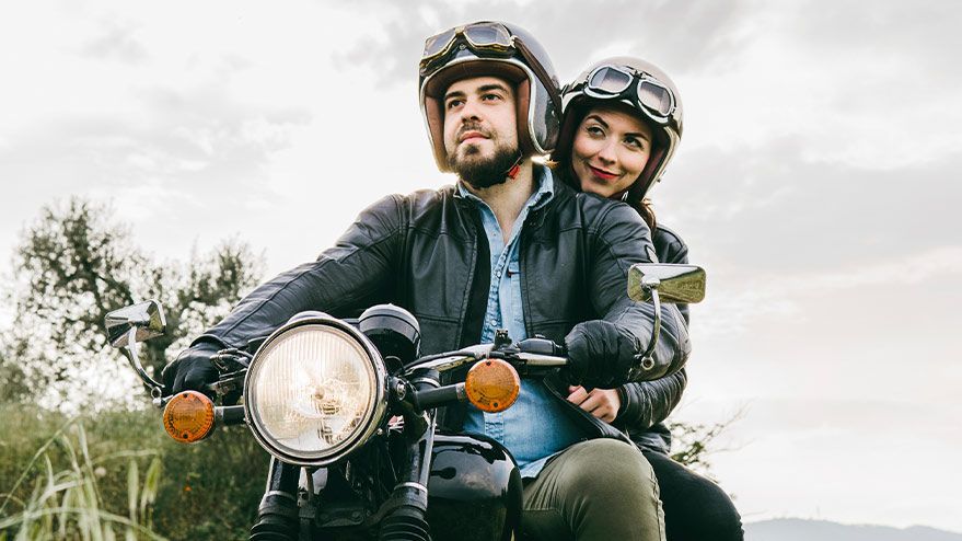 individuals on a motorcycle are protected with insurance