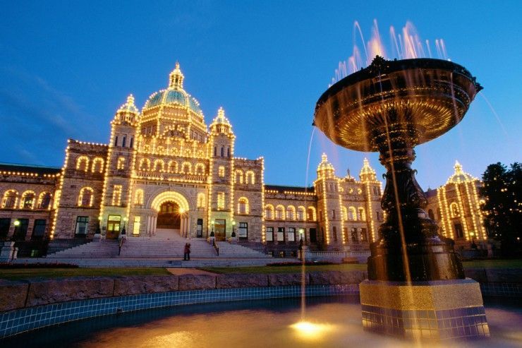 A large building with a fountain in front of it
