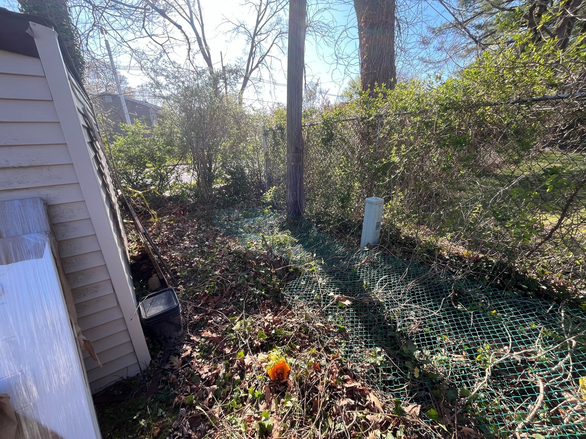 Old chain link fence removal before vinyl fence installation in Burlington County NJ