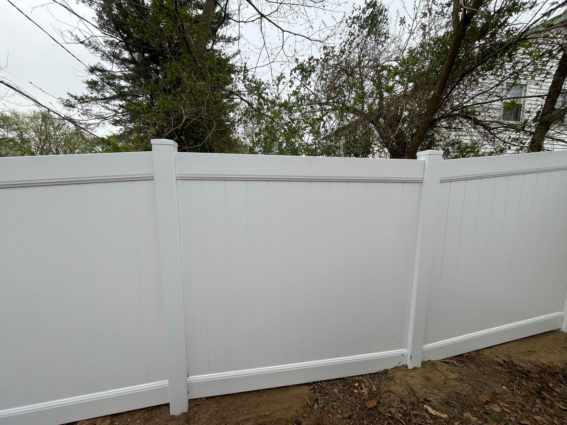Completed white vinyl fence replacement in Burlington County NJ