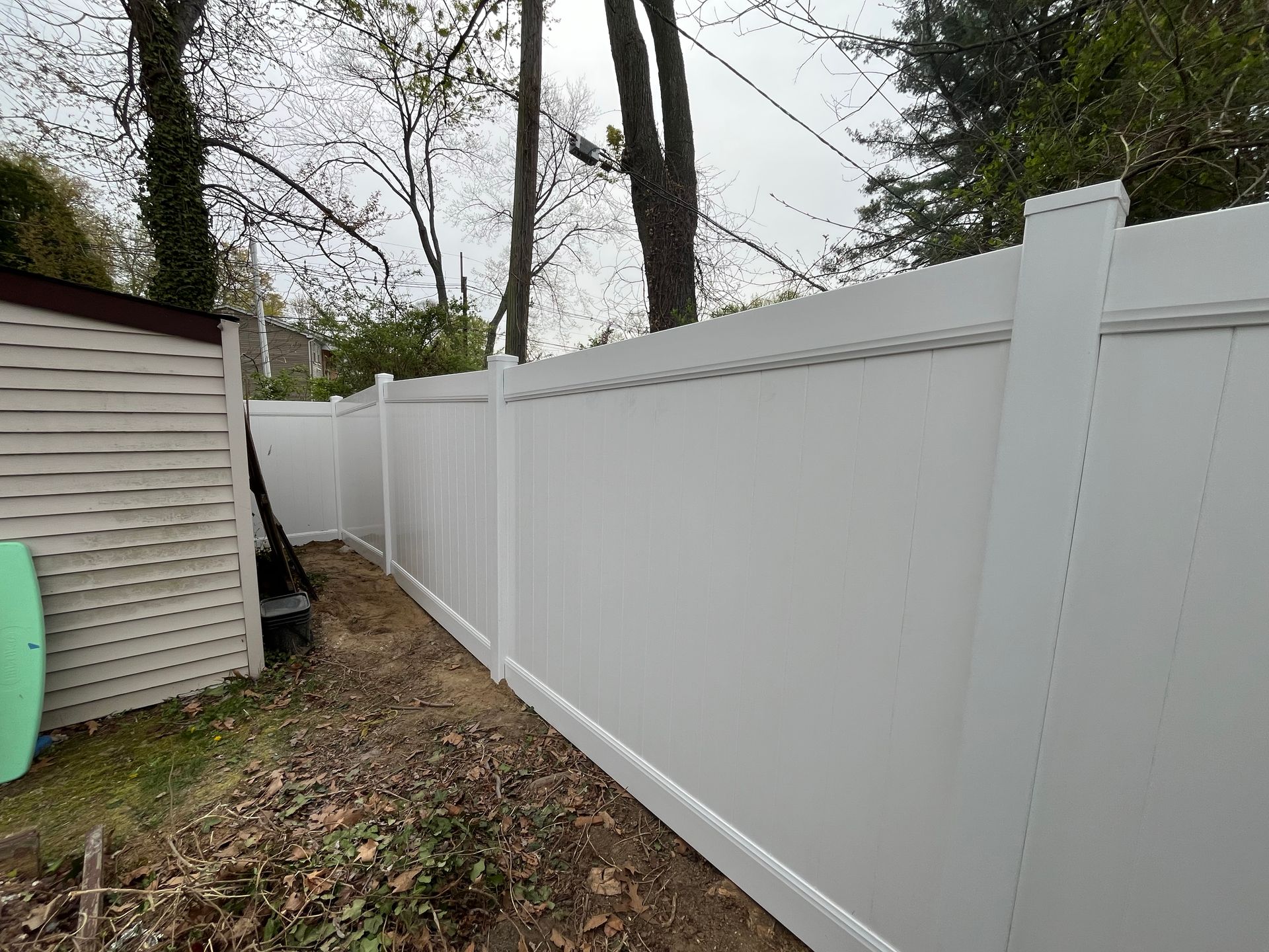 Side yard white vinyl privacy fence installation in Burlington County NJ