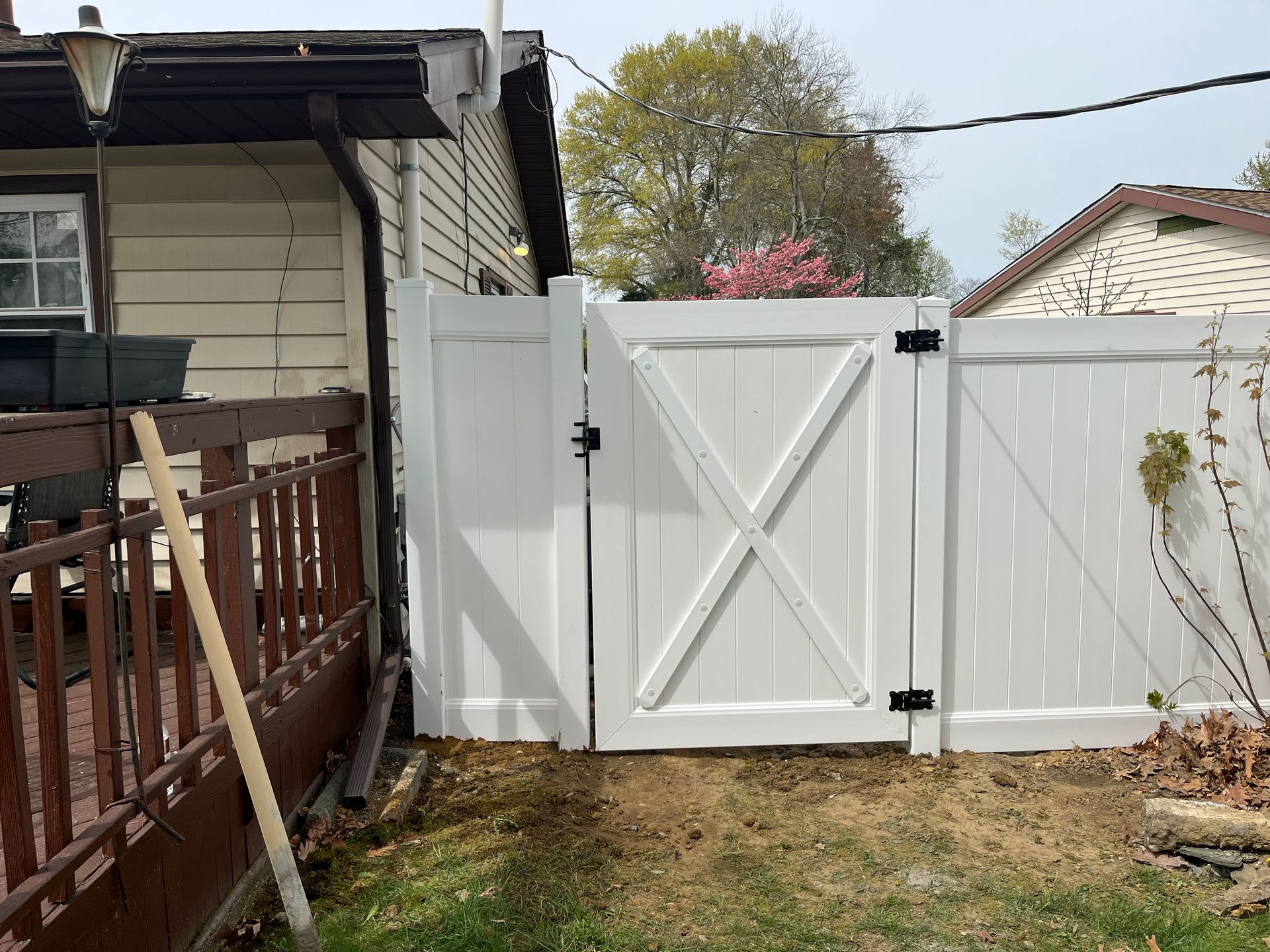 Custom white vinyl fence gate installation in Burlington County NJ