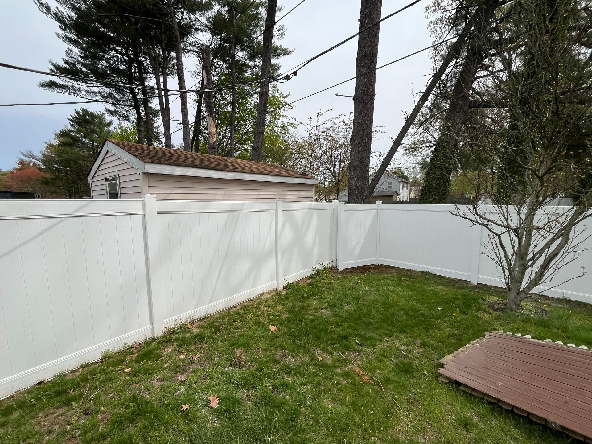 Backyard white vinyl privacy fence project in Burlington County NJ